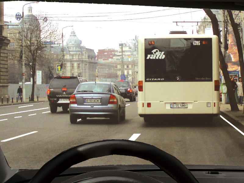 Is it legal to overtake the bus stopped in the station?