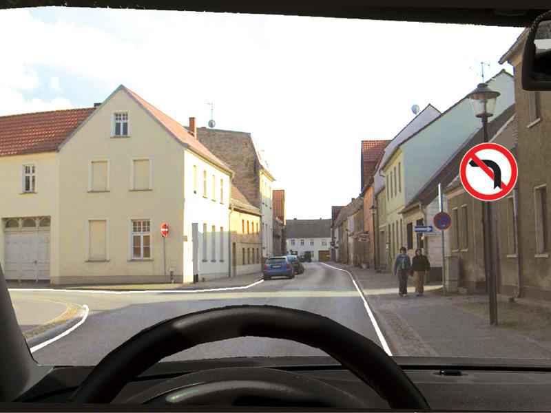 The sign does not allow changing the direction of travel to the left: