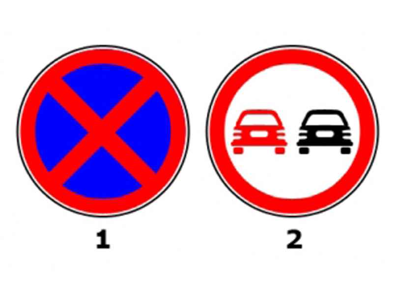 Which of the two signs prohibits stopping?