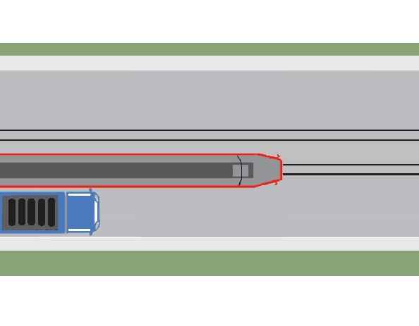 Does the driver of the truck in the adjacent image correctly perform the overtaking of the tram that is approaching the station?