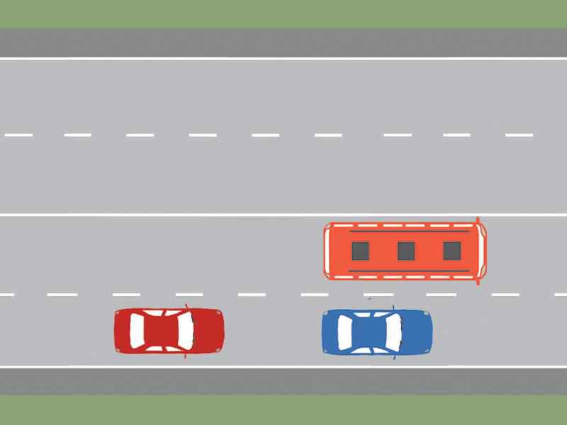 How must the driver of the bus proceed in the image if he notices that the tire of the right rear wheel is flat?